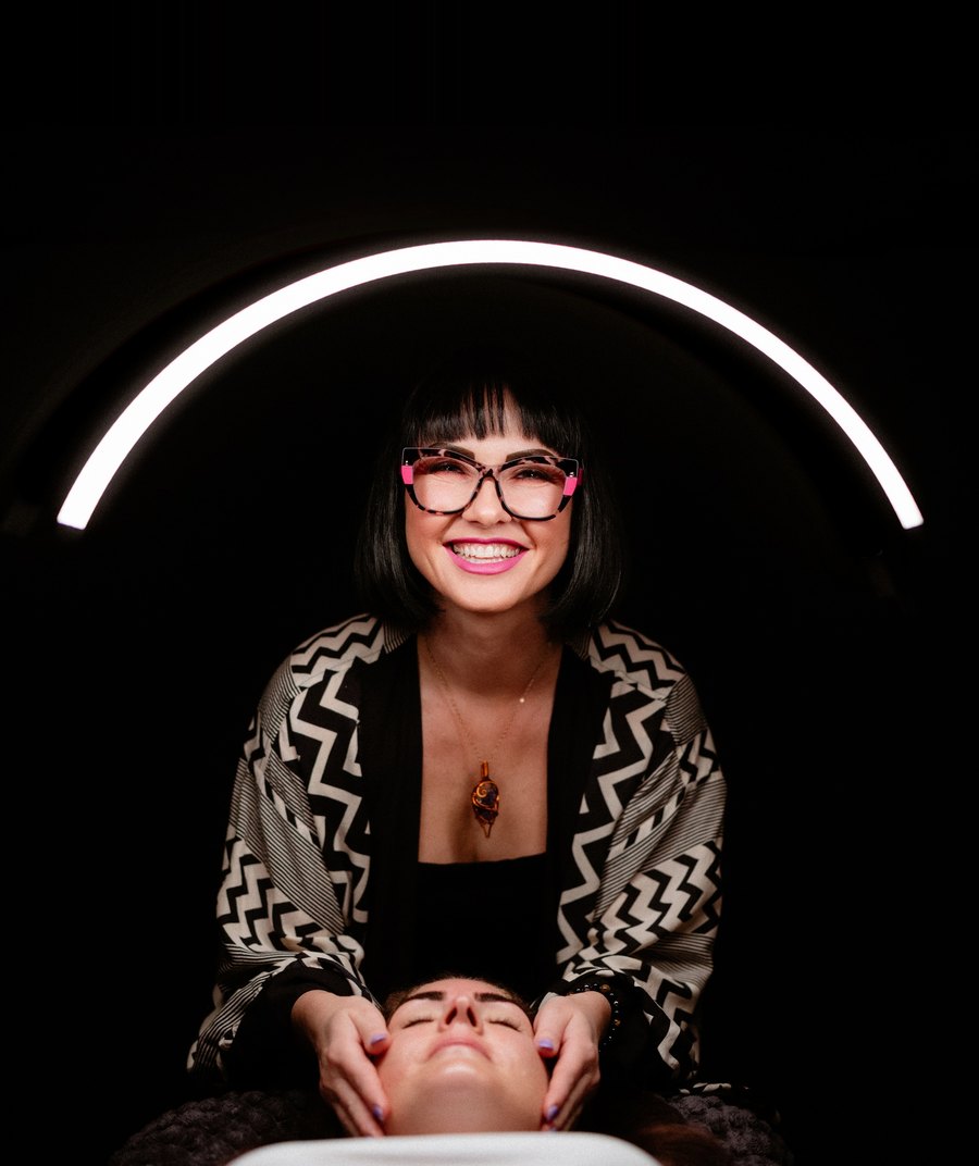 Kasia, founder of Soulsis Collective, under the arc light