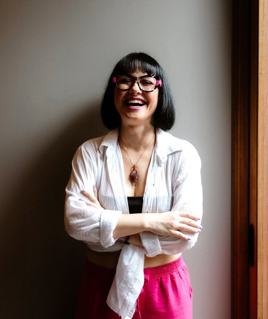 Kasia, founder of Soulsis Collective, laughing by the window